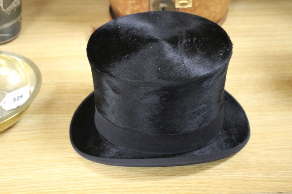 A moleskin top hat in a leather box by Christys London, J. Norton, Haywards Heath, Internal dimensions 15 x 19cm